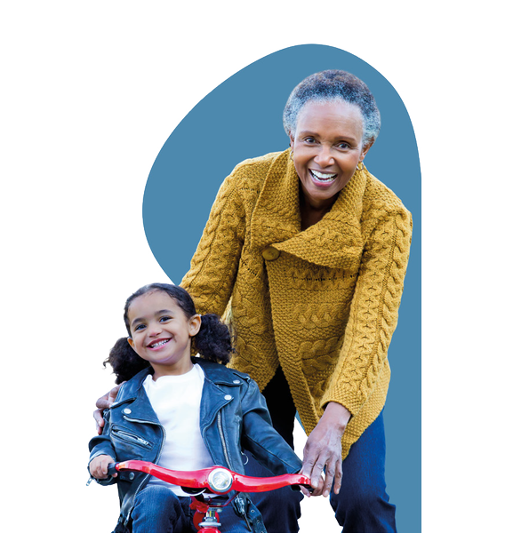 Older-lady-with-child-on-bike.png