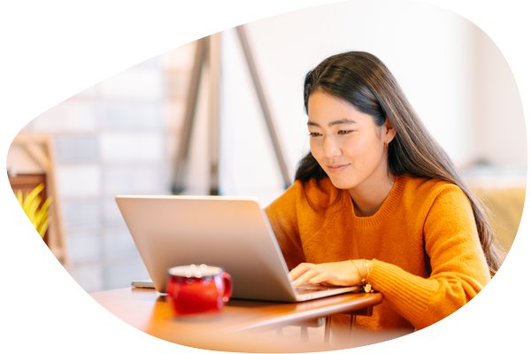 Careers-Asian female sitting at laptop.png