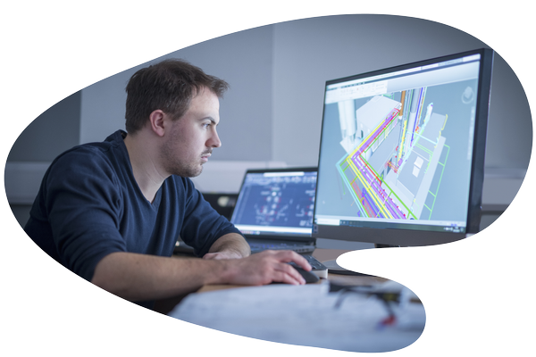 Man sitting at computer looking at screen